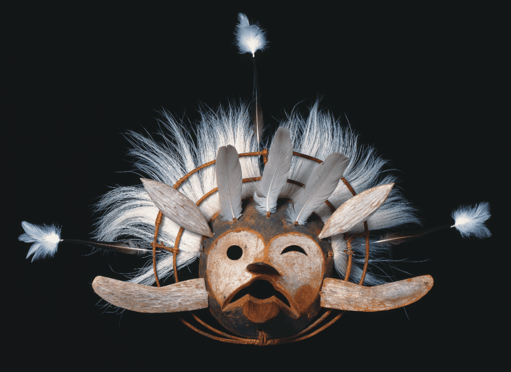 Tulukaruq kegginaquq (Raven dance mask), ca. 1870Central Yup’ik, Lower Kuskokwim, AlaskaCarved wood, pigment, feathers, caribou fur; 21 1/2 × 30 in. Fenimore Museum, Thaw Collection