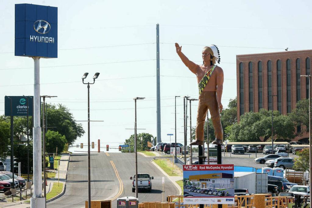 McCombs dealership's statue of American Indian coming down